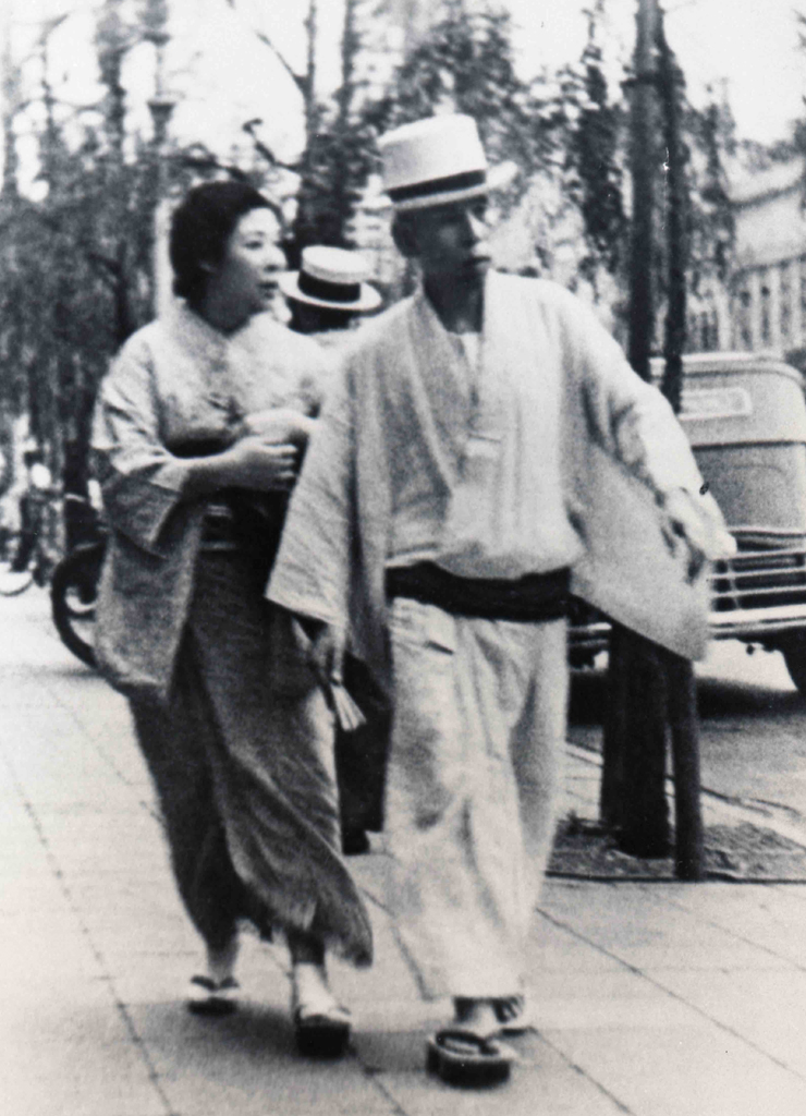 Okada together with his wife, Yoshi